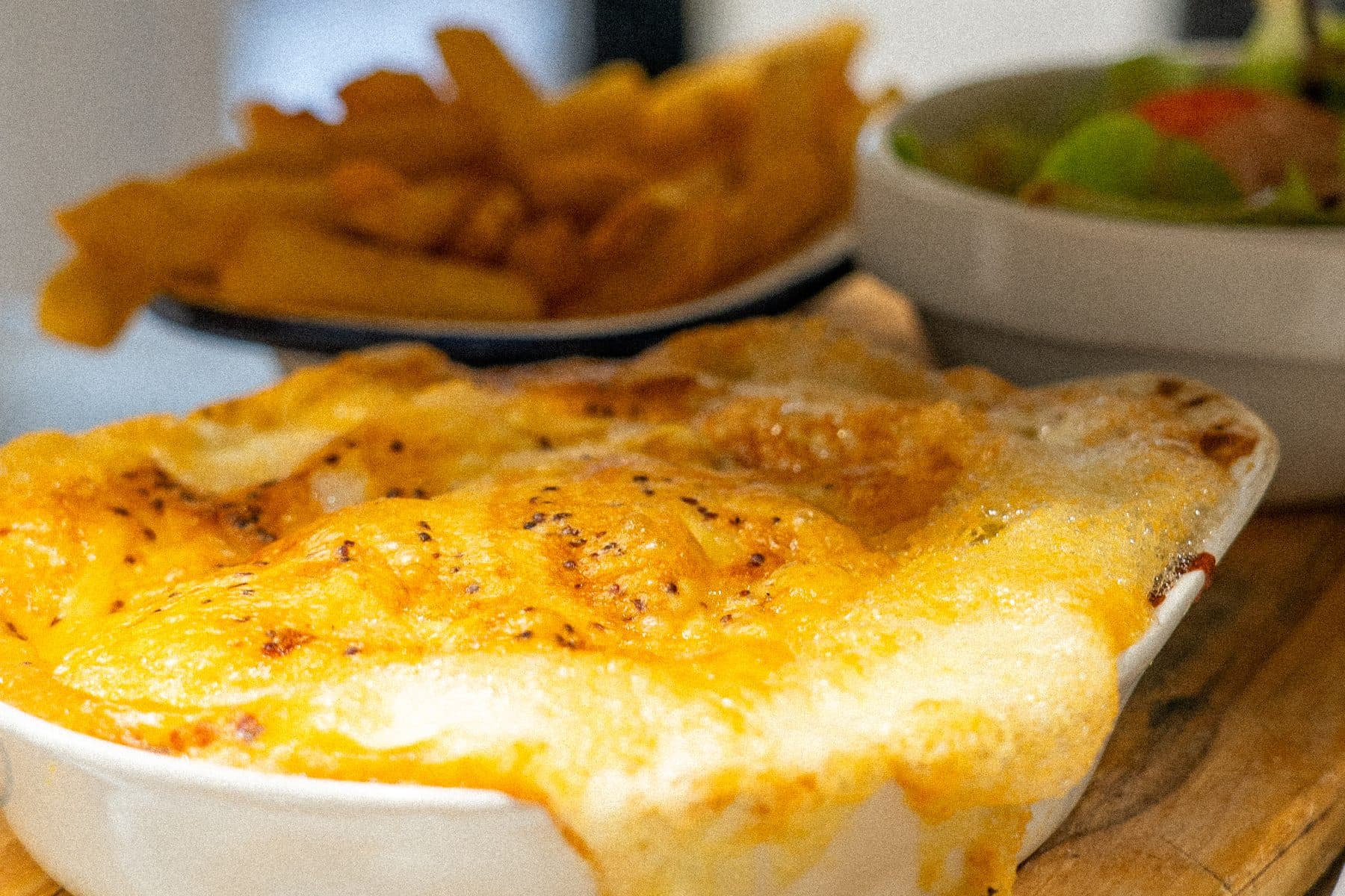A cheddar welsh straight from the oven, golden and bubbling